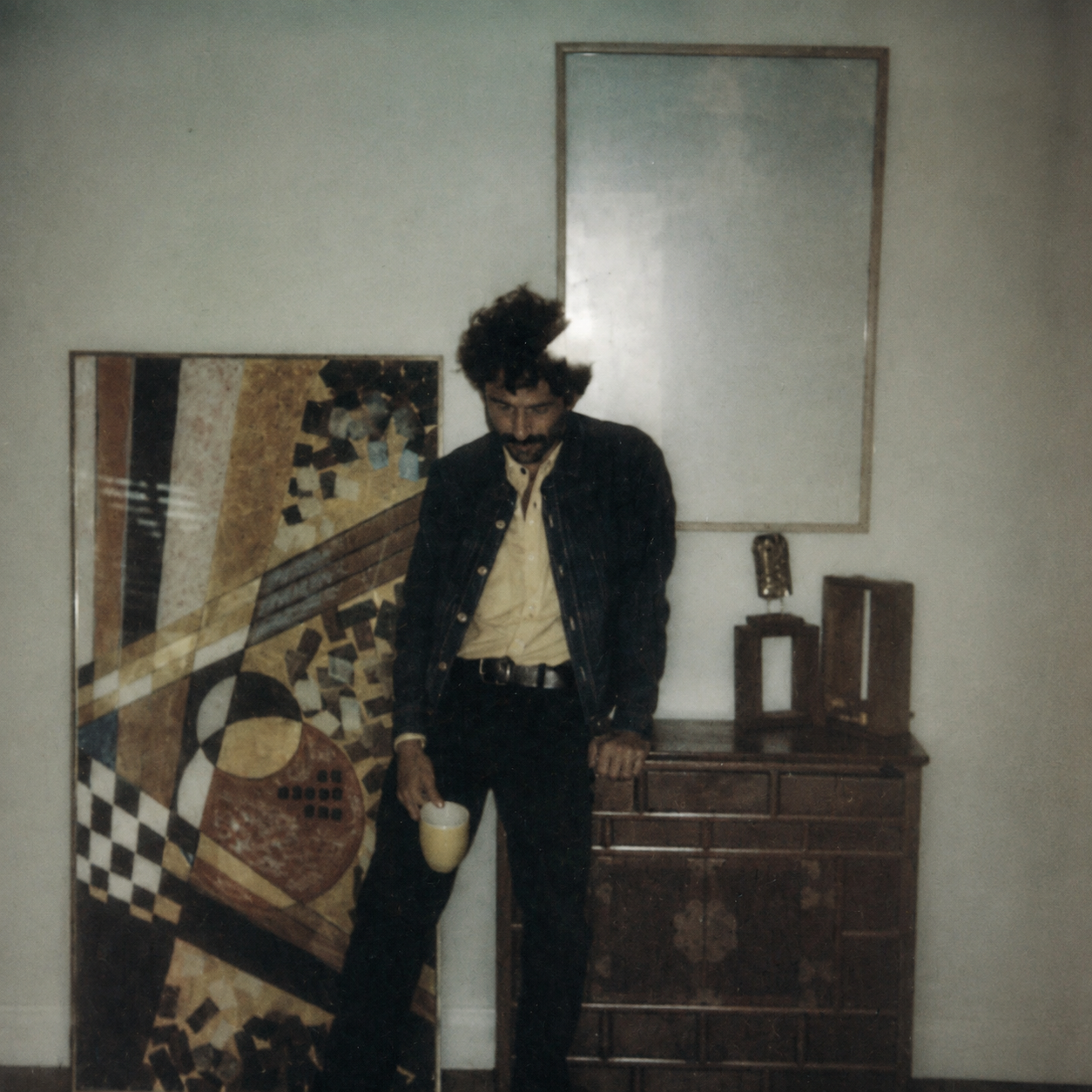 Hogan Ellis standing beneath an empty picture frame